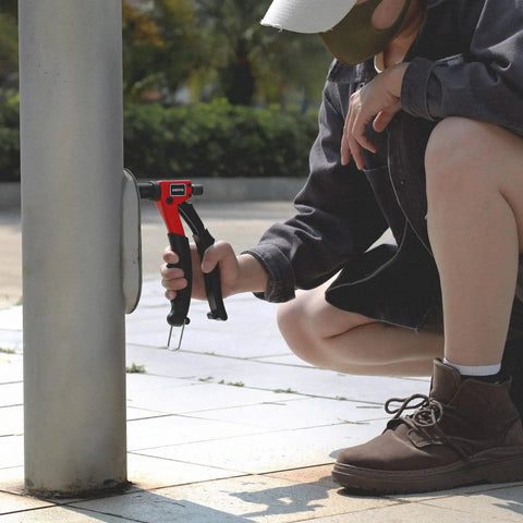 Person using 8 Inch Rivet Nut Tool Kit With 9 Metric And SAE Mandrels, 90 Rivnuts, for automotive or DIY project on metal pole.