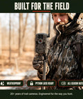 Hunter holding a Cellular Trail Camera Bundle With Tree Mount Offering 36Mp Photos And 720P Video with a camouflaged design.