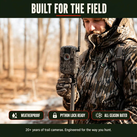 Hunter holding a Cellular Trail Camera Bundle With Tree Mount Offering 36Mp Photos And 720P Video with a camouflaged design.