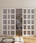 96 Inch Double Sliding Closet Doors With 5 Lite Frosted Glass Pantry Panels Gives Your Space A Fresh Look Includes Hardware Track Kit Floor Guide Pre Drilled MDF White Ready To Assemble Door Panels installed in a room