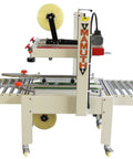 Versatile Case Sealer And Adjustable Top And Bottom Tape Dispenser Zero Stress Smooth Operator For Custom Shipping Boxes on a packing table.