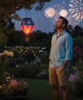 Man in garden with Hot Air Balloon Solar Lantern Outdoor Hanging LED Light For Garden Patio Pathway