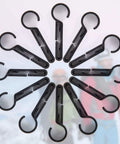 Circular arrangement of black headlamp clips for hard hats, durable plastic material, ideal for stable no slip fit on helmet