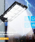 JUDYSSY Solar Street Lights Outdoor Remote Control, 2400W High Brightness Dusk to Dawn Led Lamp, Ip65 Waterproof Flood Lights for Parking, mounted on wall in rain.