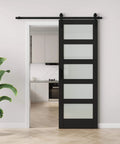 Frosted Glass Barn Door With Black Steel Frame And No Fuss Six Foot Sliding Hardware Kit, 30 by 84 Inches, shown installed in modern interior.