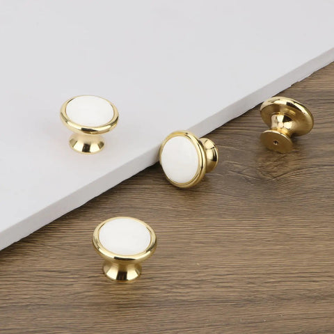Slick Vintage White Ceramic Cabinet Knob Set Four Piece Single Hole Drawer Pulls Premium Zinc Alloy Base close-up view with gold trim