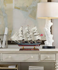 Cutty Sark 1/195 Scale Wooden Model Ship, Fully Assembled Clipper Boat Replica For Home Decor on a table.