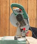 Badass Heavy Duty Two Pack Dust Collection Bags For Table Saw And Miter Saw Featuring Flexible Steel Wire Rim and Quick Zipper Bottom attached to miter saw.