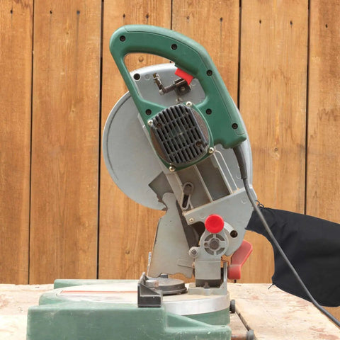 Badass Heavy Duty Two Pack Dust Collection Bags For Table Saw And Miter Saw Featuring Flexible Steel Wire Rim and Quick Zipper Bottom attached to miter saw.