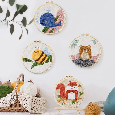 Punch Needle Kit for Adults Beginners With Adjustable Wooden Handle Tools 11 Punch Needle Sizes displayed in embroidery hoops with animal motifs.