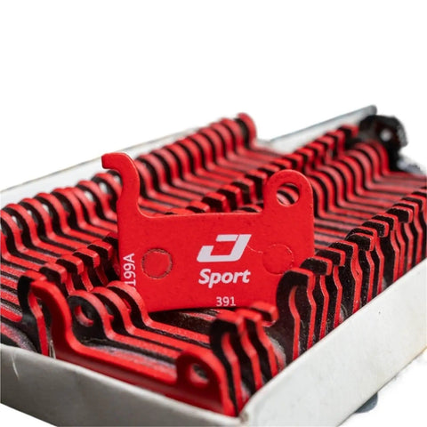Heavy Load Disc Brake Pads Compatible With Shimano And Tektro E Bikes 1 Pair, red pre-molded pads in a box.