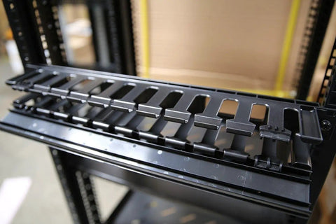 1U Horizontal Rack Mount Cable Management Unit With Panel, Plastic Construction, Fits 19 Inch Standard Equipment, Includes Mounting Screws, Panel Cover For A Neat, Organized Look, Great For Towers, Monitors, And Network Gear in rack setup.