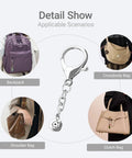 Six-piece silver pin-display keychain converter with lobster clasp and round charm for attaching enamel pins to bags.