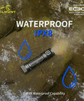 EC300 2600 Lumen Rechargeable LED Flashlight With Red Green Blue White RGB Flood Beam lying on wet rocky surface, showing waterproof feature