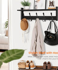 Coat Rack With Shelf And Tri Hooks Wall Mounted 24 Inch Wooden Hanging Coat Hanger For Entryway Bathroom Mudroom And Bedroom Black Finish With Stable Iron Frame For Everyday Use displayed with hats, coat, and bag hanging.