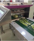 Flow Wrapper Compact Packaging Machine With 50 To 80 Pieces Per Minute wrapping snacks, shown with display panel and conveyor.
