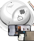 Hardwired Dual 4K Covert Security Camera Disguised As A Classic Smoke Detector view with smartphone monitors and wiring.