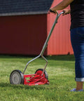 Person mowing lawn with 14 Inch Push Reel Lawn Mower With 5 Blade Ball Bearing Reel, Adjustable Cutting Height 0.5 To 1.75 Inches, Red