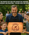Front view: Barrel-shaped wooden cutting board, personalized with JUSTIN'S STEAK HOUSE, held by a man.