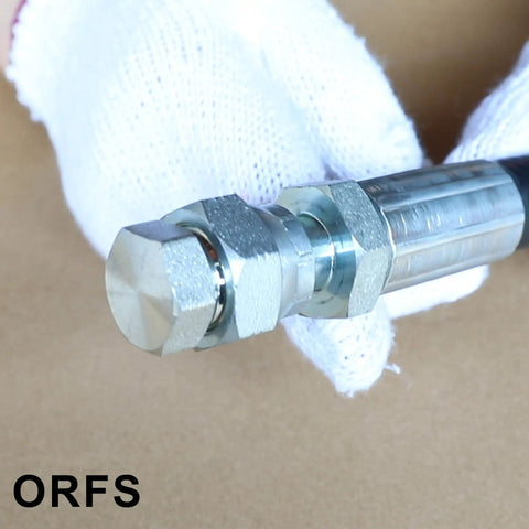 Close-up of hydraulic hose with ORFS Flat Face Seal Cap And Plug Kit For Hydraulic Hose Fittings 72 Piece Set with 6 UNF Threads.