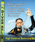 Diver using 4 Foot Surface Marker Buoy For Scuba With Reflective Strip High Visibility Inflatable Signal Tube at sea surface