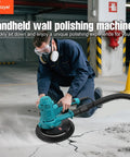 Person using Variable Speed Handheld Electric Drywall Sander With Automatic Vacuum System indoors on concrete floor.