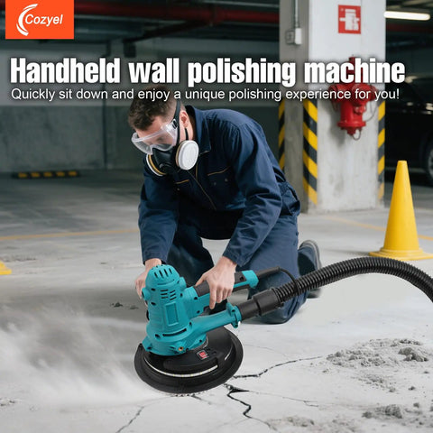 Person using Variable Speed Handheld Electric Drywall Sander With Automatic Vacuum System indoors on concrete floor.