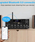 Powerhouse 2 Channel 500W Bluetooth 5.0 Home Audio Amplifier With FM Radio Echo AUX USB SD Mic Inputs on a shelf with speakers
