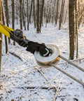 3 Inch Wide 8 Foot Tree Saver Strap With Loops Heavy Duty Winch And Recovery Tow Strap 30000 Lbs MBS attached to tree in snow