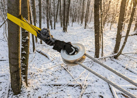 3 Inch Wide 8 Foot Tree Saver Strap With Loops Heavy Duty Winch And Recovery Tow Strap 30000 Lbs MBS attached to tree in snow