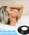 Woman relaxing in a bubble bath with a black rubber bathtub drain stopper, part of 10 Elastic Rubber Bathtubs Drain Stoppers Gaskets.
