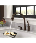 Pillar Kitchen Soap Dispenser For Pillar Waterfall And Linden Faucets Venetian Bronze Finish 13 Oz Bottle Fits Deck Thickness Up To 2.5 Inches Slick Sinks Accessory next to running faucet.