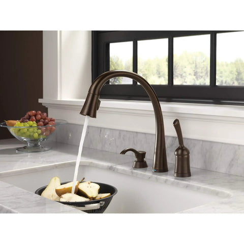 Pillar Kitchen Soap Dispenser For Pillar Waterfall And Linden Faucets Venetian Bronze Finish 13 Oz Bottle Fits Deck Thickness Up To 2.5 Inches Slick Sinks Accessory next to running faucet.