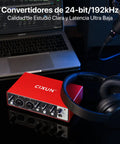 Matte red 2x2 USB C audio interface for PC and Mac next to laptop and headphones, plug and play, 24-bit 192kHz recording.
