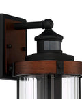 Rock Solid Black Motion Sensor Outdoor Wall Sconce With Zero Fuss Industrial Craftsmanship And Reliable Nighttime Security Lighting For Front Porch Or Driveway close-up of motion sensor on heavy-duty fixture