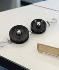 Hands On Ten Piece Mechanics Pulley Block Set With Heavy Duty Metal Fixed And Movable Pulleys Ropes Hooks Transparent Storage Case STEM Physics Lab Kit For Teaching Simple Machines In Classrooms Or Home Labs, two black metal pulleys with hooks