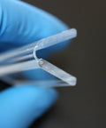 3 Pack Clear Acrylic Flexible Living Hinges 300mm Continuous Strip held with blue glove, showcasing low profile design and slick material.