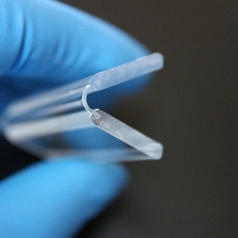 3 Pack Clear Acrylic Flexible Living Hinges 300mm Continuous Strip held with blue glove, showcasing low profile design and slick material.