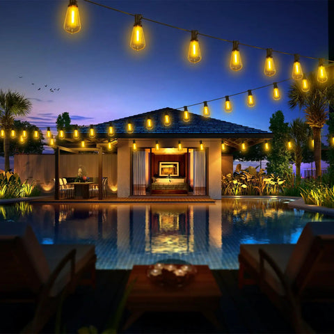 100 Foot LED Outdoor String Lights With 52 Shatterproof Vintage Edison Bulbs illuminating a patio and pool in warm glow