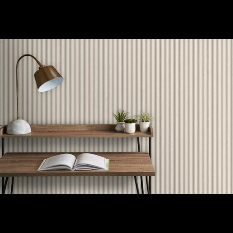 Kick Up Your Walls With Rustic Farmhouse PVC Free Type II Wallpaper Matte Linen Finish Heavy Duty For Kitchens And Baths Easy Paste To Paper Setup Good For Any Space shown on a textured wall behind a wooden shelf and desk with plants.