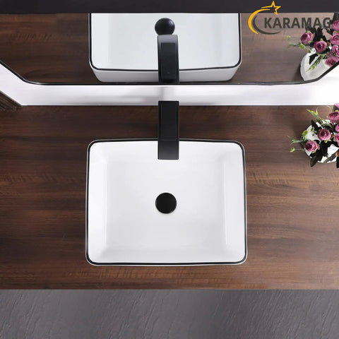 White Rectangle Vessel Sink For Bathroom Above Counter Porcelain Ceramic Basin With Black Rim Edge Modern European Inspired Design 18 Inch Exterior Sleek Small Sink Bowl For Bathrooms top view on wooden countertop with faucet.