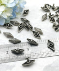 Kickass Diamond Shape Rivets With Screw Back Studs For Leather Crafting and Jacket Embellishment Heavy Duty Zinc Alloy decorative conchos shown with ruler.
