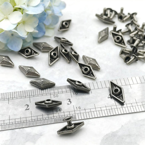 Kickass Diamond Shape Rivets With Screw Back Studs For Leather Crafting and Jacket Embellishment Heavy Duty Zinc Alloy decorative conchos shown with ruler.