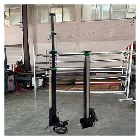 Kick Ass Dual Mode Telescopic Mast Electric Motor With Manual Hand Crank Backup, showing two aluminum alloy antenna poles in workshop.