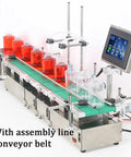 Heavy Duty Double Head Liquid Filling Machine With Belt Conveyor And Digital Control Built Different For Perfume Oil And Juice Bottling Operations showing red-filled jars on conveyor.