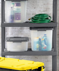 18 Pack Plastic Storage Bins With Lids 25 Quart Gray Shelf Totes Heavy Duty Durable Clear Containers Fits Standard Shelving Made In Usa on shelves with cleaning supplies.