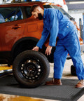 Mechanic using 3 X 5 Foot Anti Fatigue Floor Mat Extra Thick Fifteen Sixteenths Inch Ergonomic Diamond Plate Heavy Duty Non Slip Industrial Grade Mat To Ease Leg And Back Pain Durable Gray in car workshop
