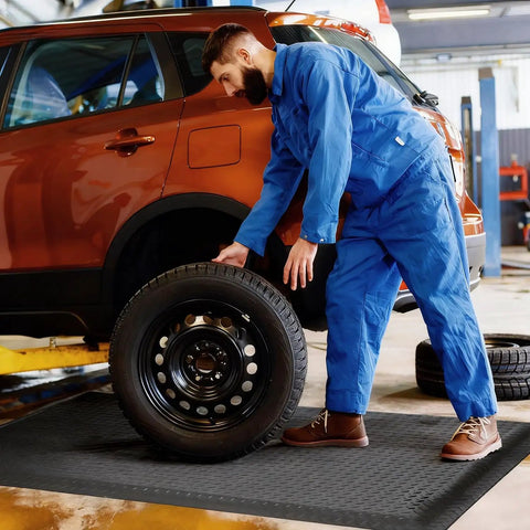 Mechanic using 3 X 5 Foot Anti Fatigue Floor Mat Extra Thick Fifteen Sixteenths Inch Ergonomic Diamond Plate Heavy Duty Non Slip Industrial Grade Mat To Ease Leg And Back Pain Durable Gray in car workshop