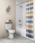 Modern bathroom setup featuring a toilet, bathtub, and decorative shower curtain with geometric patterns.