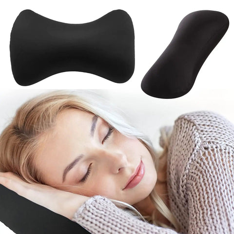 Woman resting on black Squishy Microbead Neck Pillow 15x8 Inch Lightweight Bean Shaped Throw Cushion, ergonomic support for travel.